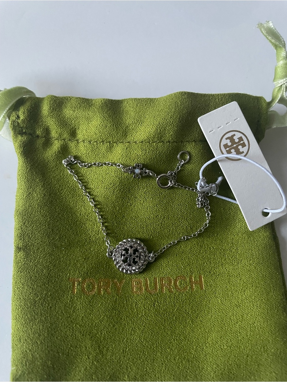Tory Burch Silver Logo Medallion Bracelet with Green Pouch